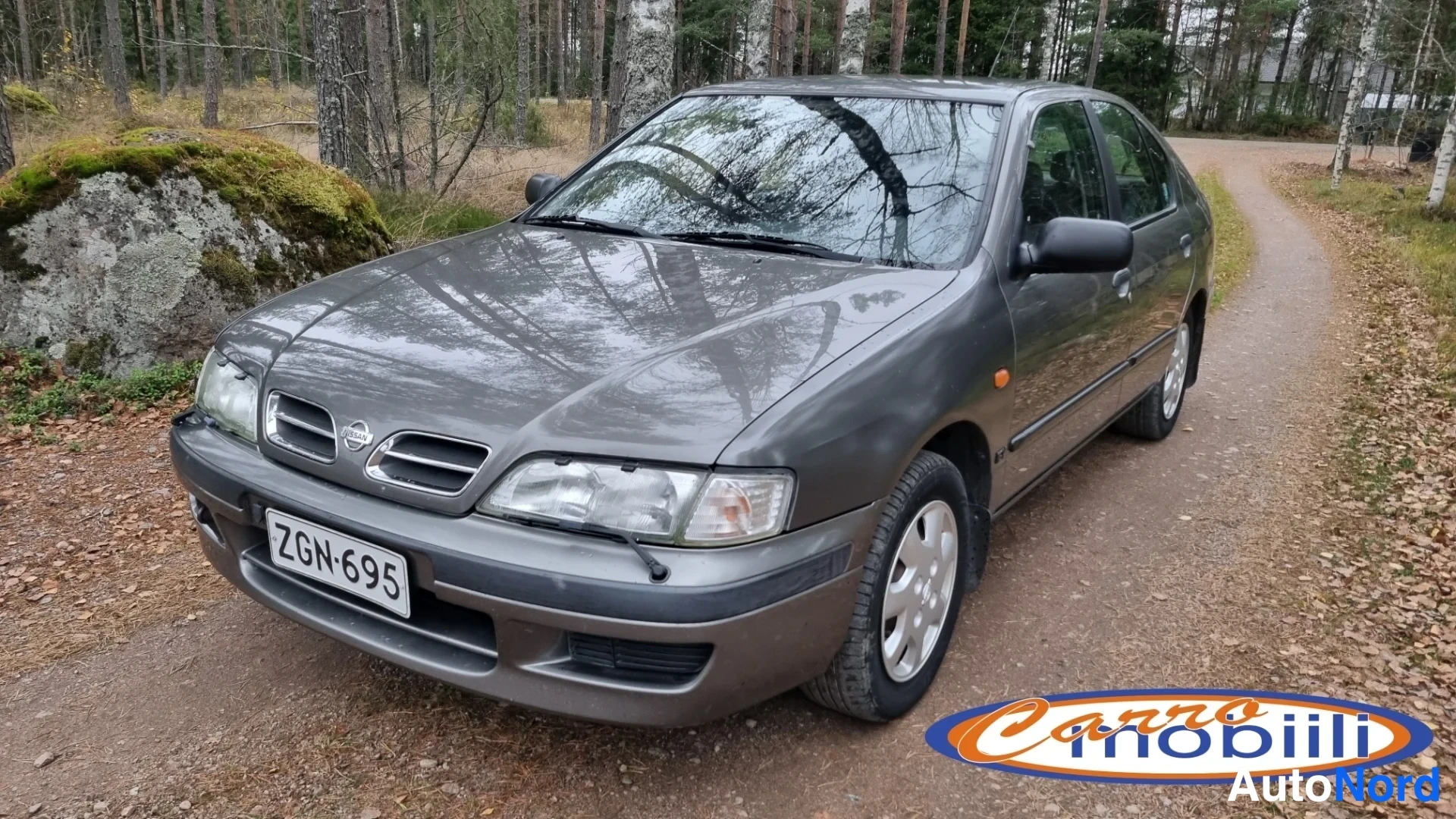 Grey Nissan Primera 1997, front three-quarter, nose to the left, photo 1