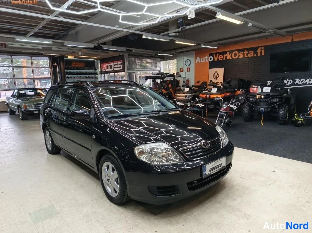 Black Toyota Corolla 2006, front three-quarter, nose to the left, photo 2