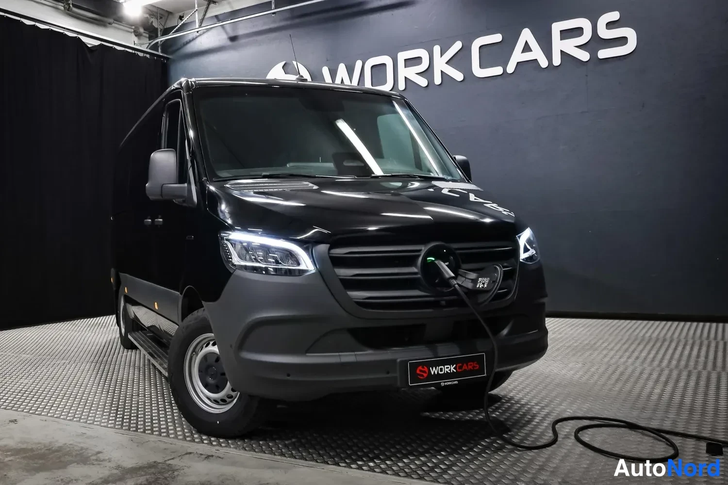 Black Mercedes-Benz Sprinter 2026, front three-quarter, nose to the right, photo 2