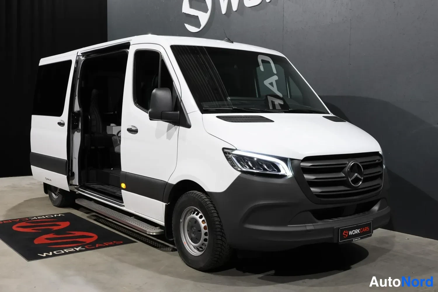 White Mercedes-Benz Sprinter 2026, front three-quarter, nose to the right, photo 3