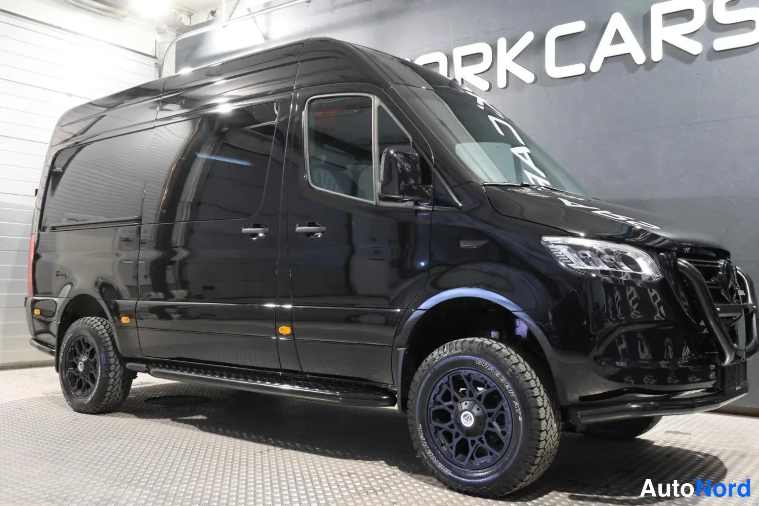 Black Mercedes-Benz Sprinter 319 CDI 2026, front three-quarter, nose to the right, photo 2