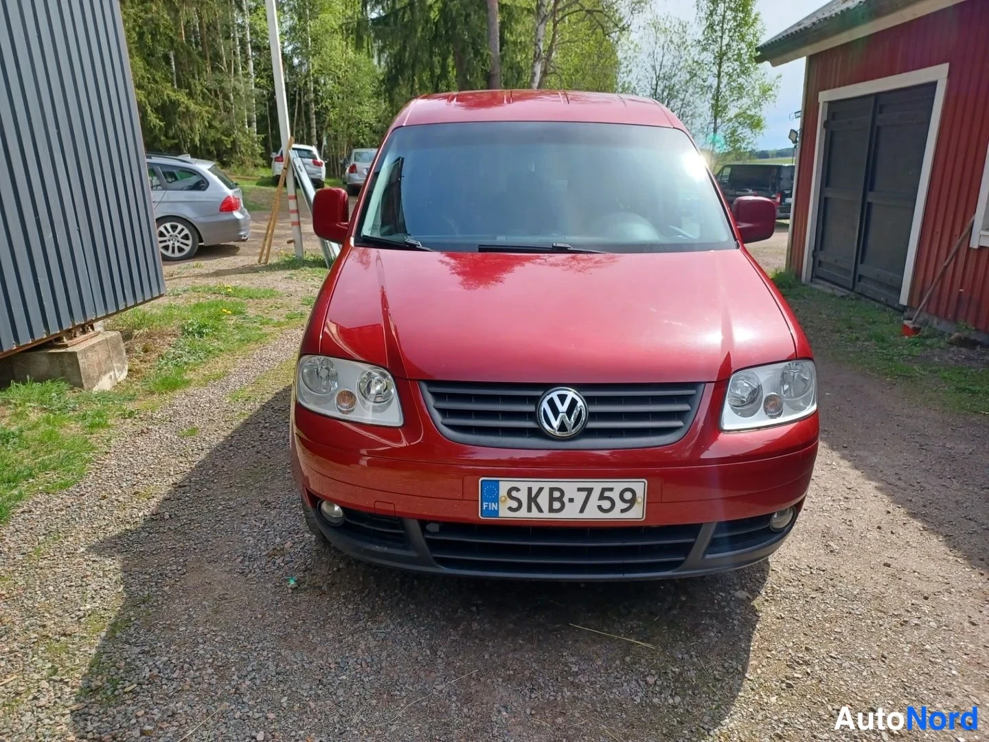 Punainen Volkswagen Caddy Life 2009, edestä, kuva 5