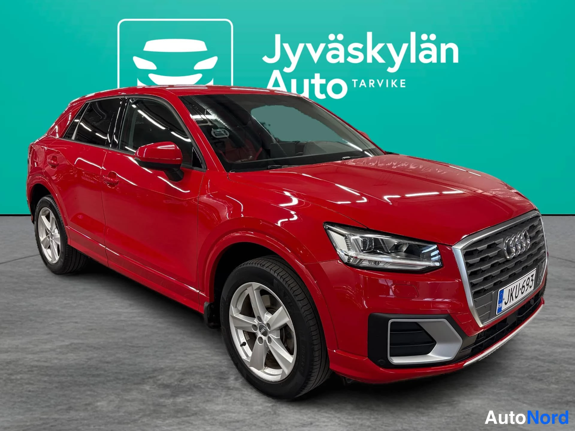 Red Audi Q2 2018, front three-quarter, nose to the right, photo 2