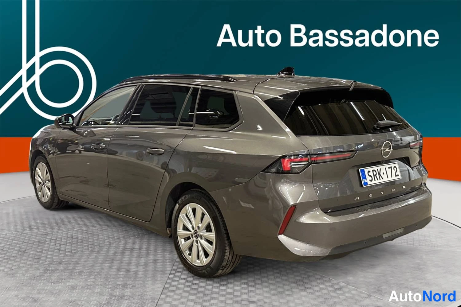 Grey Opel Astra Sports Tourer 2024, rear three-quarter, photo 6