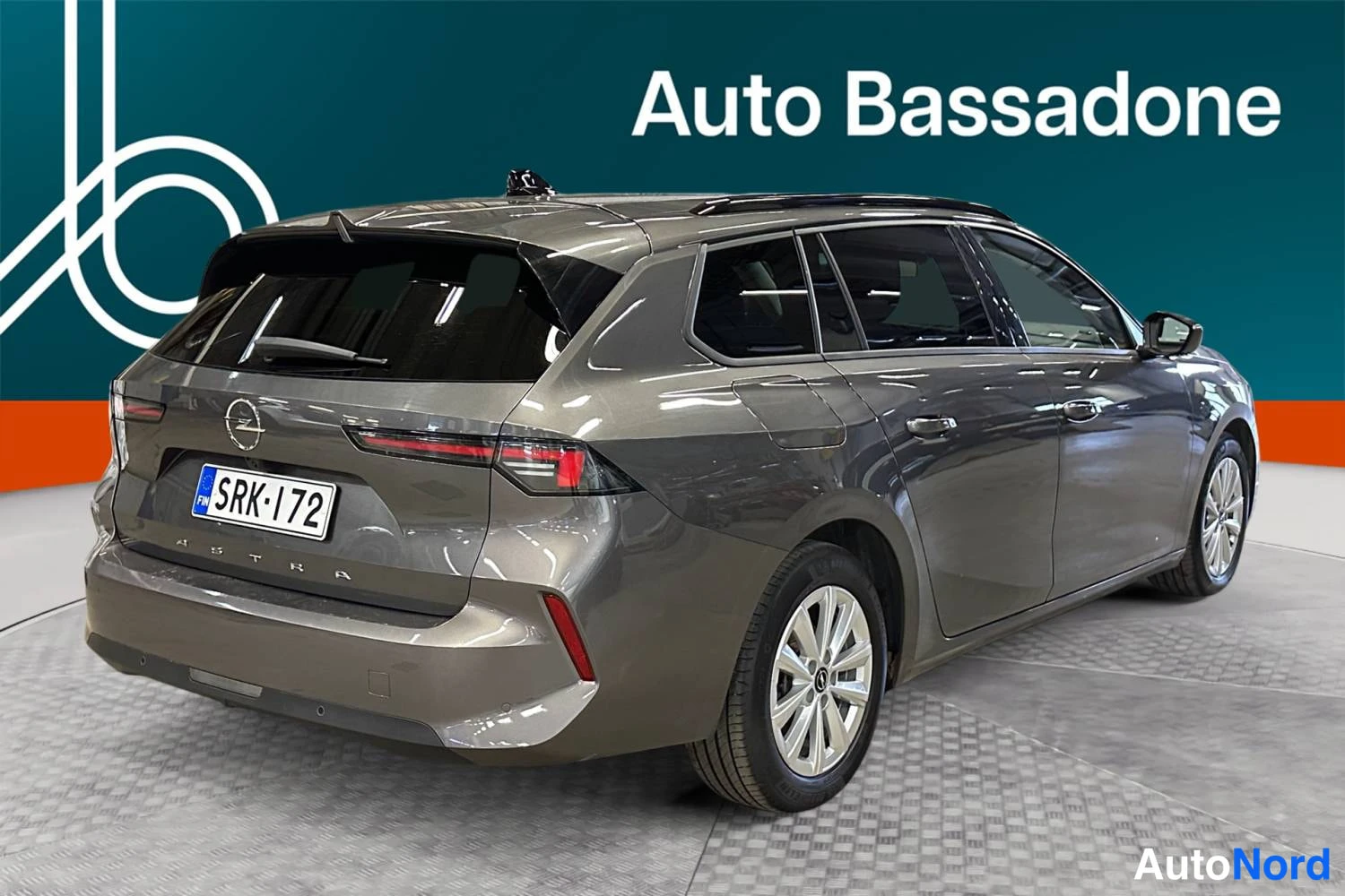 Grey Opel Astra Sports Tourer 2024, rear three-quarter, photo 7