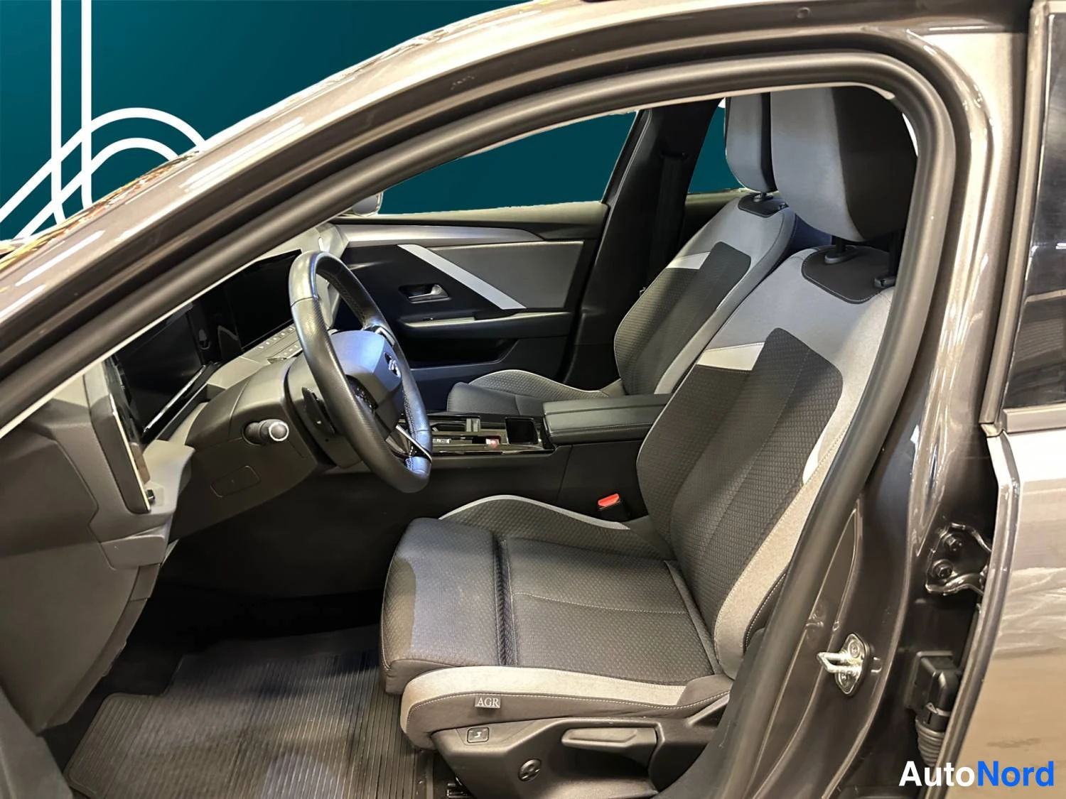 Grey Opel Astra Sports Tourer 2024, cockpit, photo 9