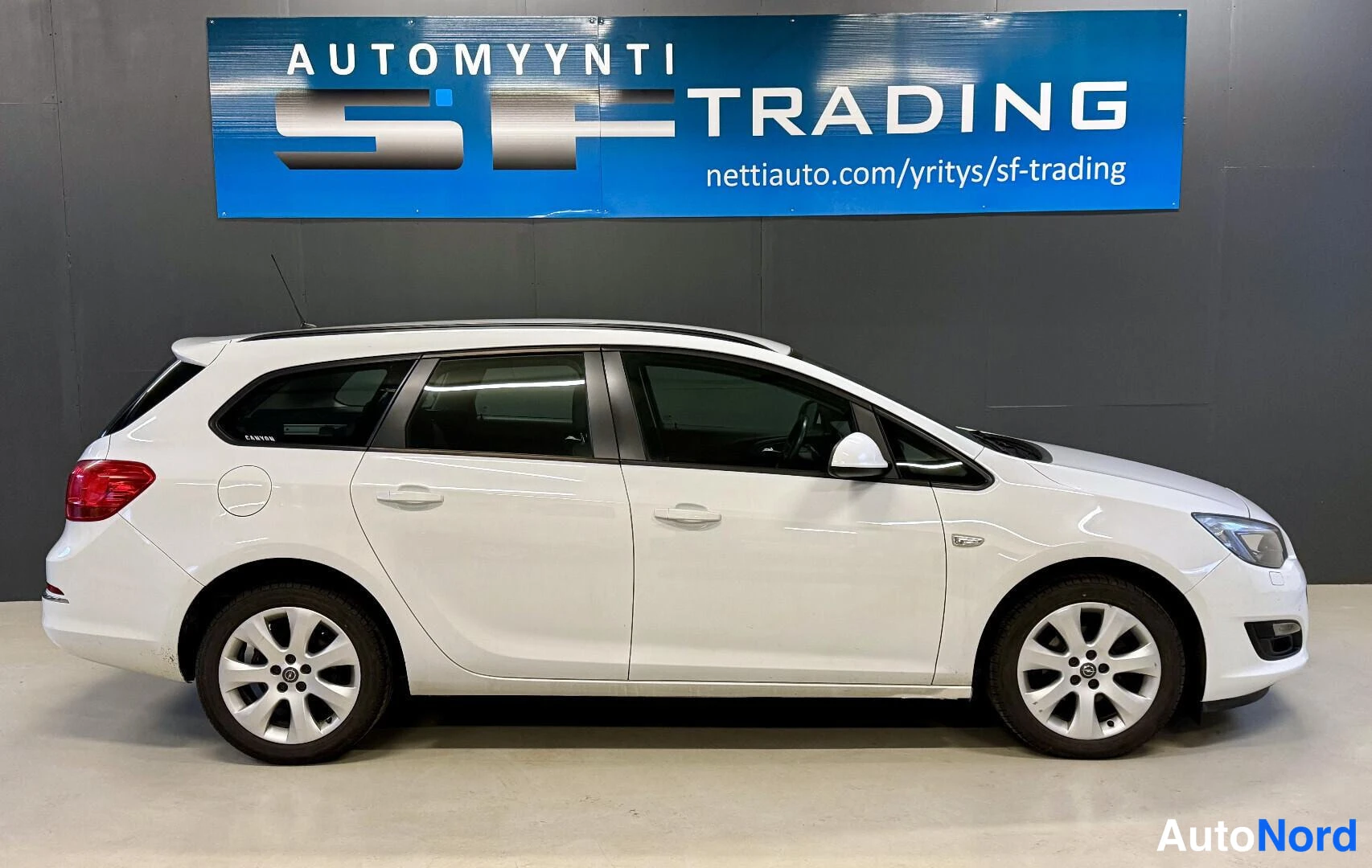 Valkoinen Opel Astra 2013, kuva 5